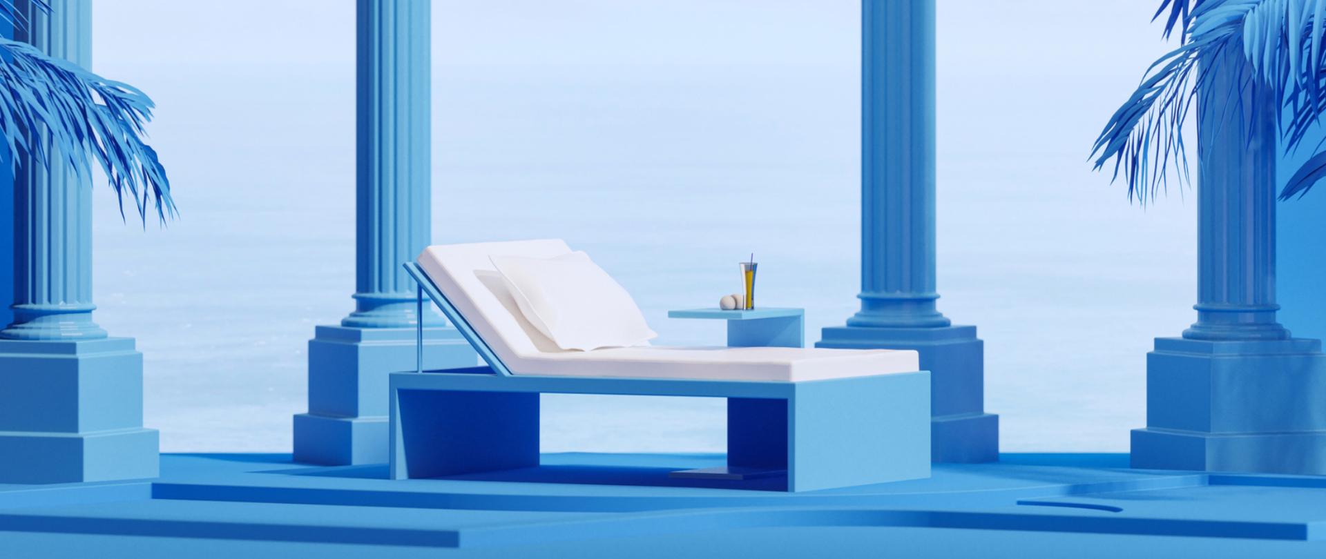 Na grafice znajduje się leżak, obok którego na stoliku widoczny jest napój. Tło jest niebieskie.