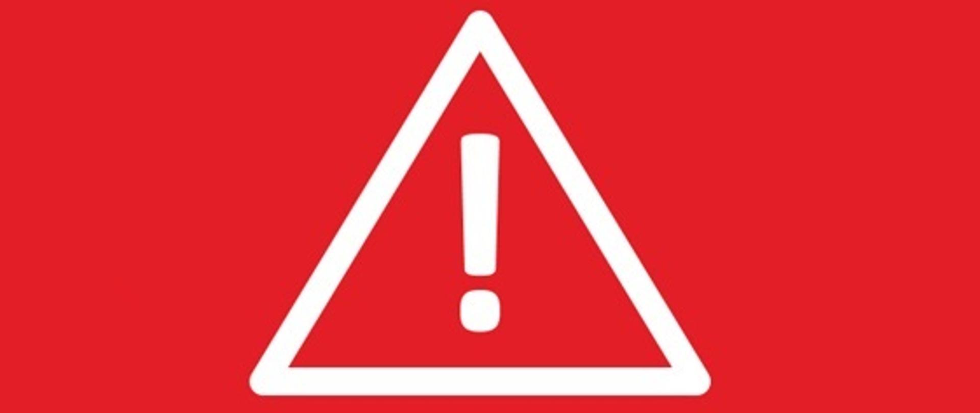 Czerwony baner z centralnie umieszczonym wykrzyknikiem i napisem "KOMUNIKAT"