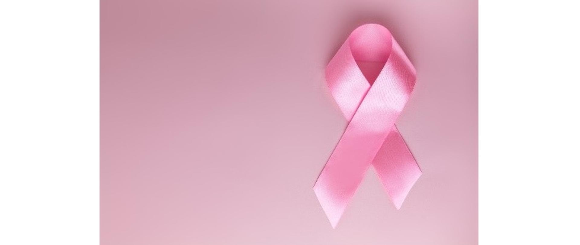Różowa wstążeczka na jednolitym różowym tle