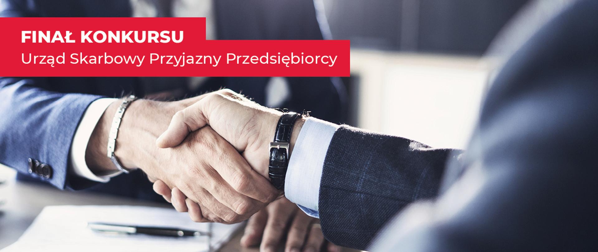 Uścisk dłoni i napis Finał konkursu Urząd Skarbowy Przyjazny Przedsiębiorcy.