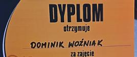 Pomarańczowo czarny dyplom strażaka Dominika Woźniaka za zajęcie III miejsca