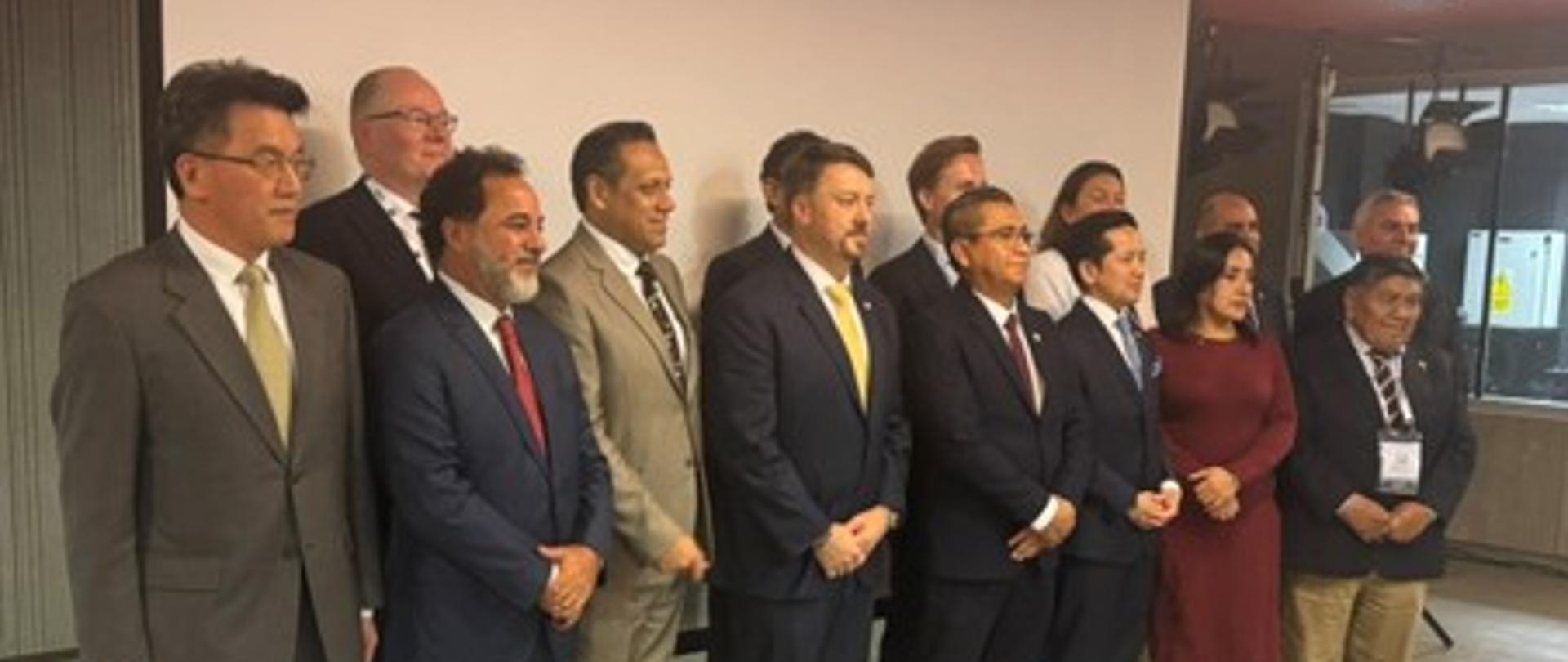 Deputy Minister of Climate and Environment Krzysztof Galos during the 27th World Mining Congress in Lima, Peru. The photograph shows the Deputy Minister together with other participants posing for a group photo.