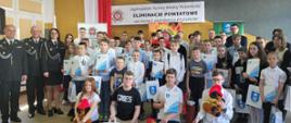 Zdjęcie przedstawia uczestników powiatowych eliminacji Turnieju Wiedzy Pożarniczej 2024