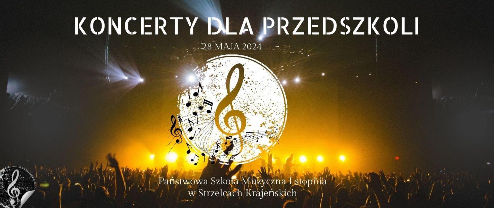 W tle oświetlona scena wraz z publicznością, na środku klucz wiolinowy na białym tle i czarnymi nutkami, w lewym dolnym rogu biały klucz wiolinowy na czarnym tle, treść; Koncerty dla przedszkoli 28 maja 2024, Państwowa Szkoła Muzyczna I stopnia w Strzelcach Krajeńskich.