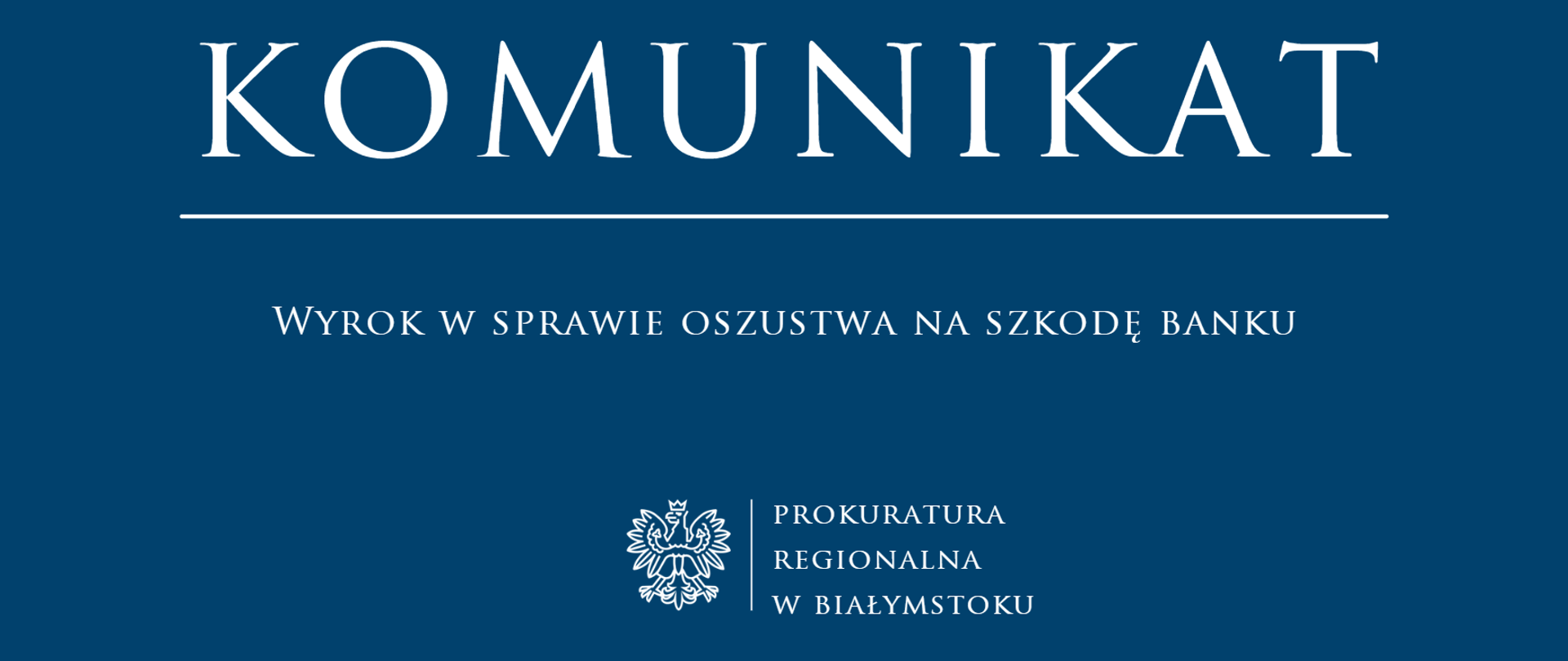 Grafika ma ciemnoniebieskie tło, na którym umieszczono białe napisy oraz godło państwowe. Centralną część zajmuje duży nagłówek "KOMUNIKAT", pod którym znajduję się pozioma linia oddzielająca oraz tekst informujący o Wyroku w sprawie oszustwa na szkodę banku