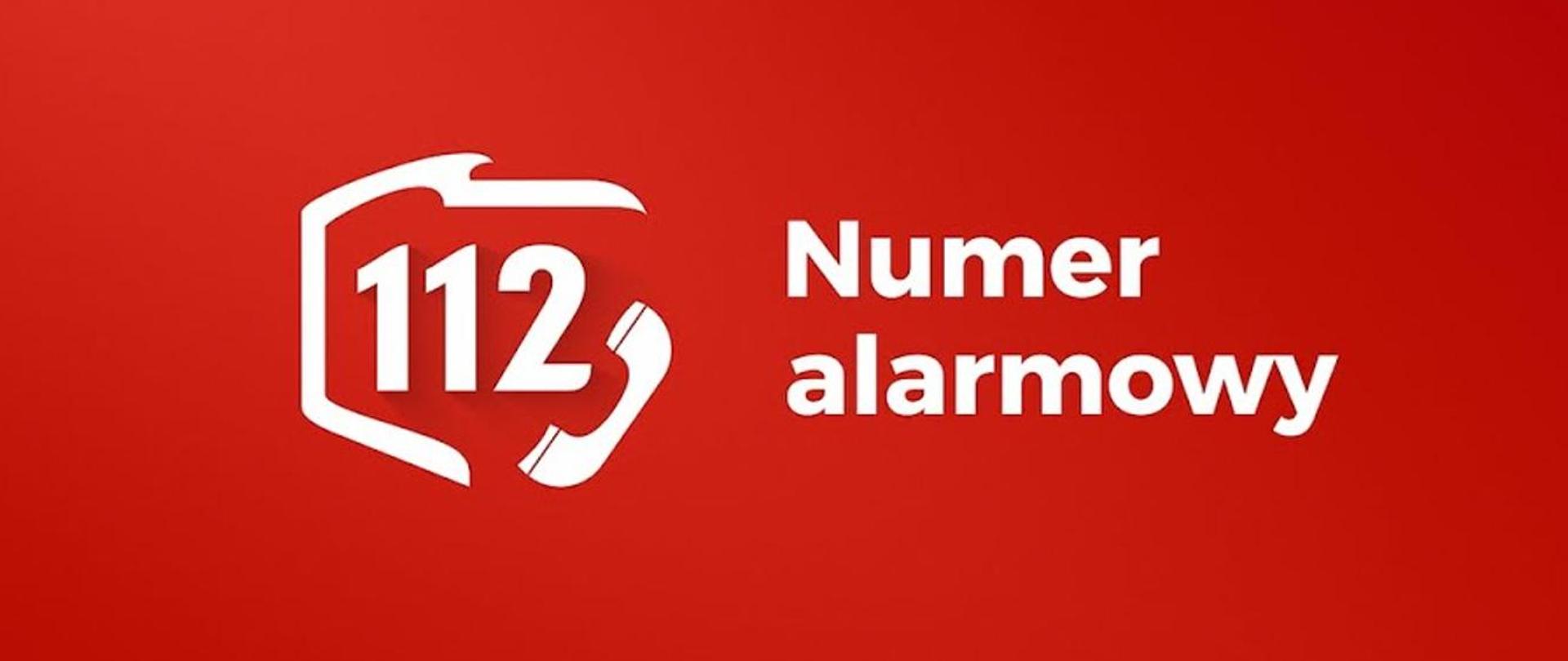 Zdjęcie przedstawia biały napis: 112 Numer alarmowy. Napis na czerwonym tle.
