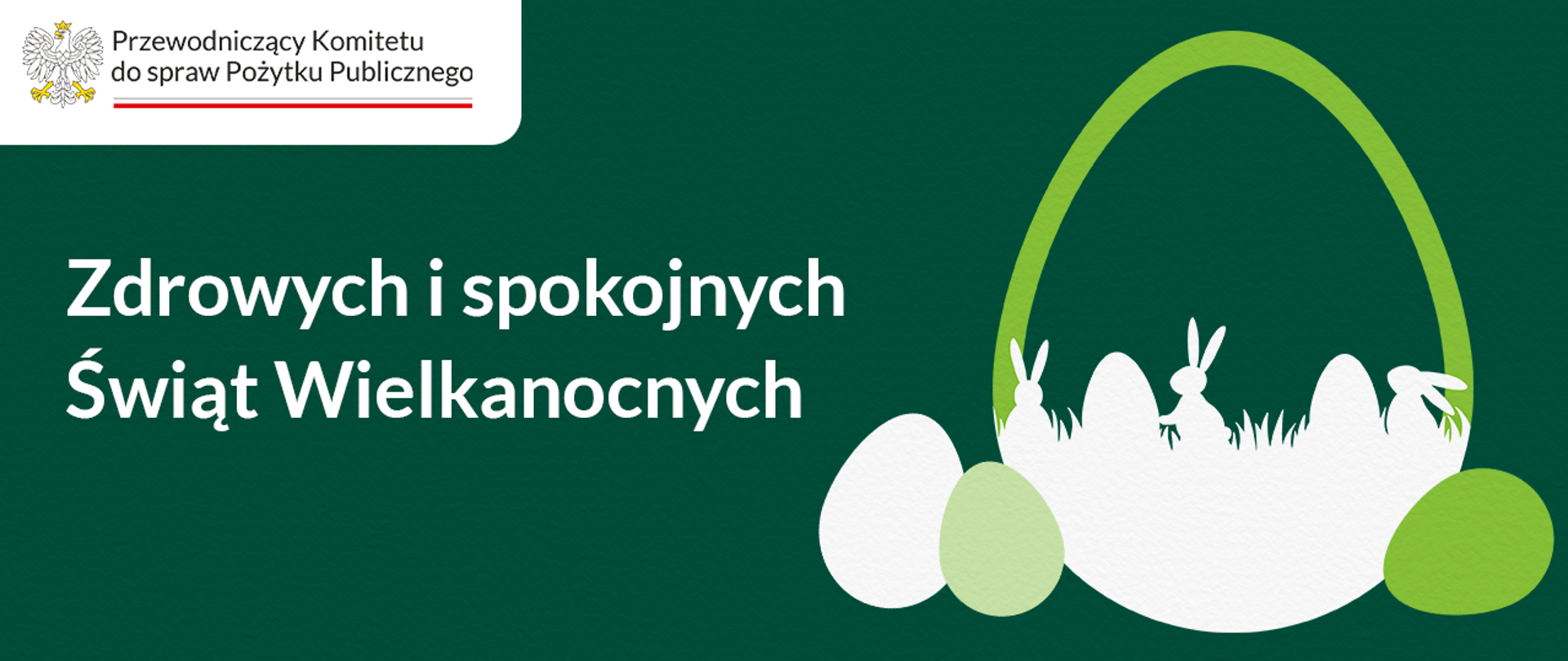 Grafika okolicznościowa. Spokojne, jednolite tło. W lewej części grafiki tekst: Zdrowych i spokojnych Świąt Wielkanocnych. Obok symboliczny rysunek: wielkanocny koszyczek w kształcie jajka. W obrysie koszyka widoczne są jajka, zające i źdźbła trawy. Po obu stronach koszyka umieszczone są jajka o różnej wielkości. W lewym górnym rogu logo Przewodniczącego Komitetu do spraw Pożytku Publicznego.