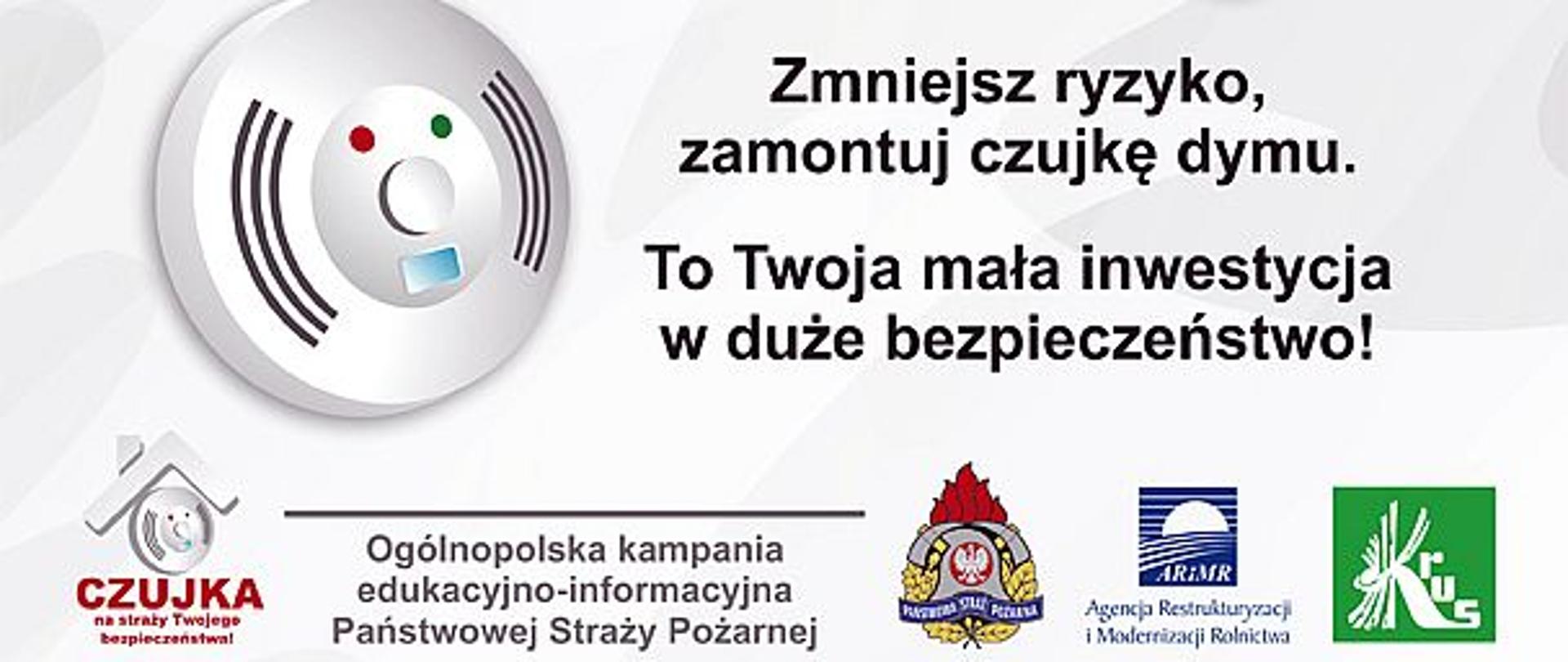 Zdjęcie przedstawia baner promocyjny akcji. Na zdjęciu czujka, loga promotorów kampanii oraz hasło przewodnie " Zmniejsz ryzyko, zamontuj czujkę dymu"