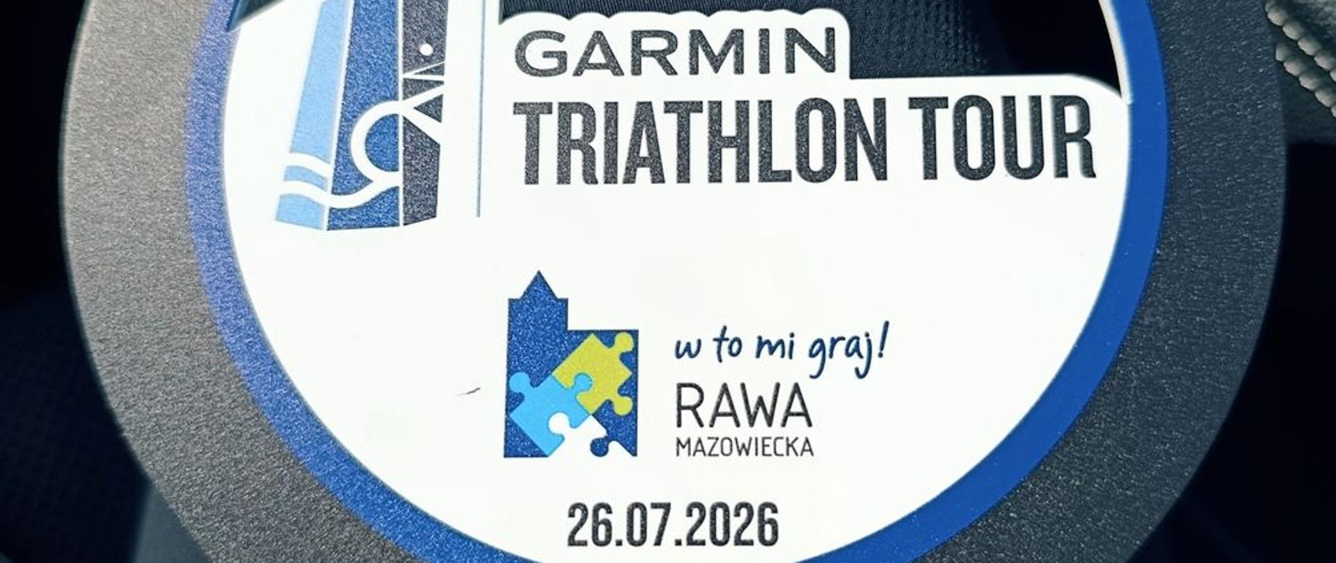 Zdjęcie przedstawia medal Mistrzostwa Służb Mundurowych i Paramundurowych w ramach Garmin Triathlon Tour Rawa Mazowiecka 2026 