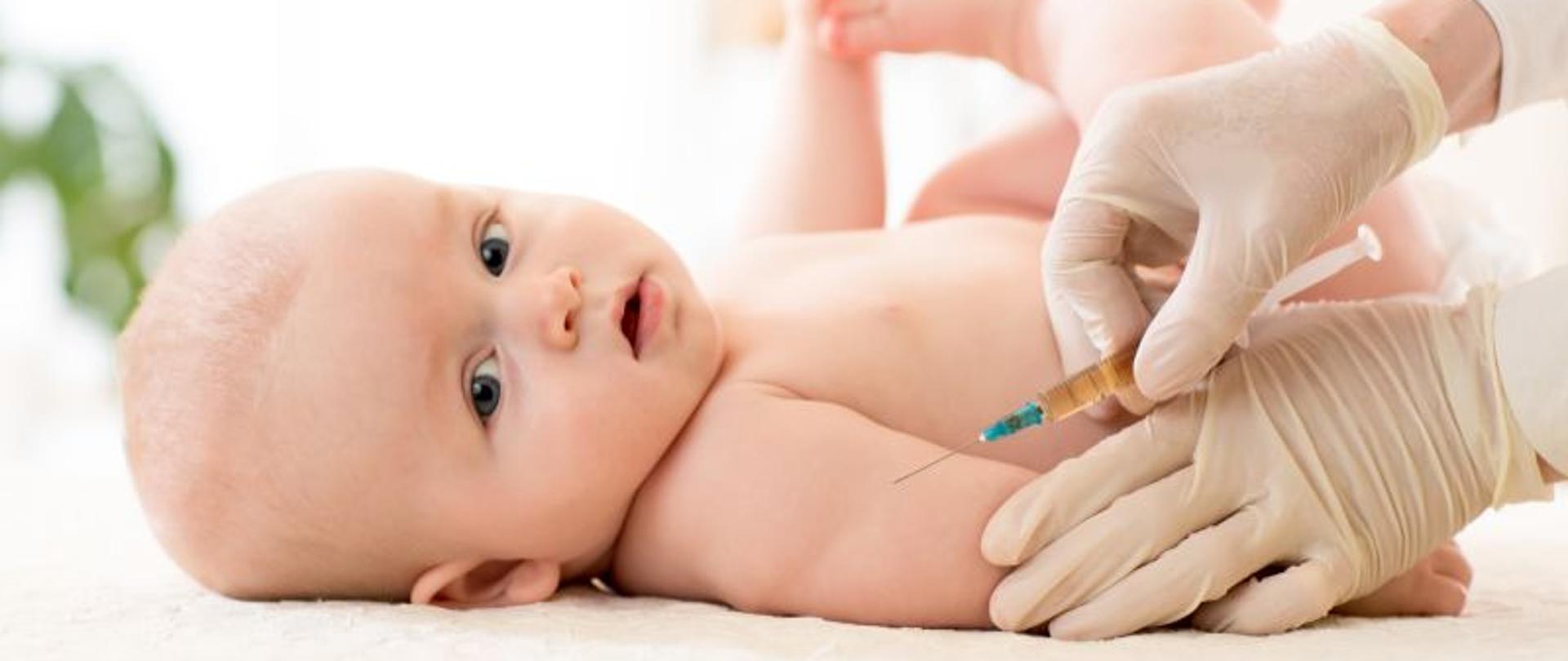 Pediatrics doctor giving baby child vaccine injection