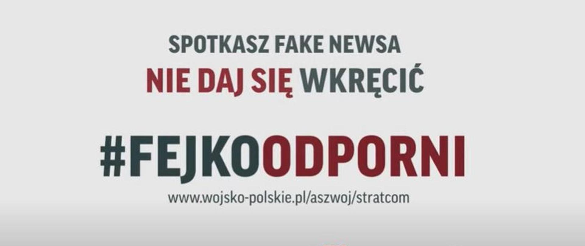 Obraz w poziomie. Na szarym tle czarno-czerwony napis "Spotkasz fake newsa nie daj się wkręcić! #fejkoodporni"