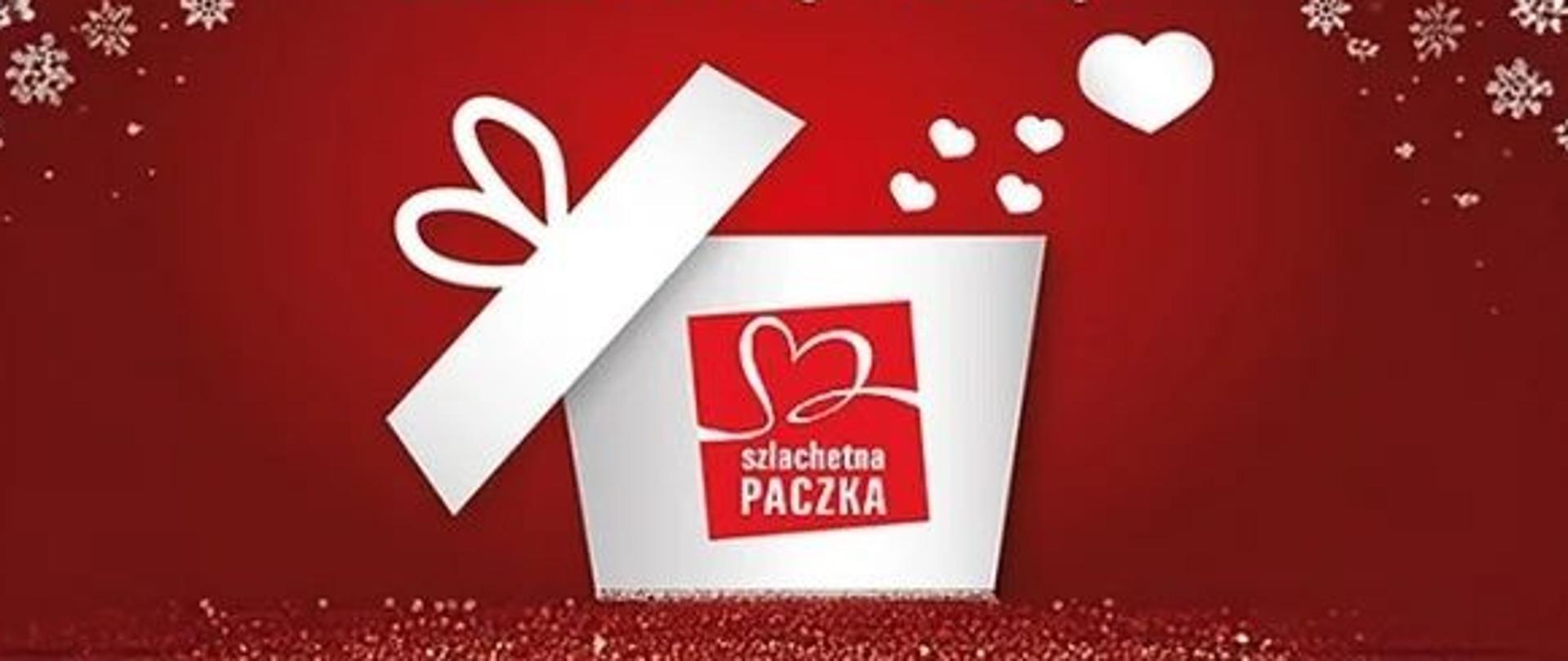 Czerwony plakat z białymi śnieżynkami. Na środku znajduje się otwarte pudełko z logo akcji Szlachetna Paczka – czerwonym sercem wpisanym w kwadrat. Z pudełka unoszą się białe serduszka. Nad nim widnieje napis: Stwórzmy razem Szlachetną Paczkę!