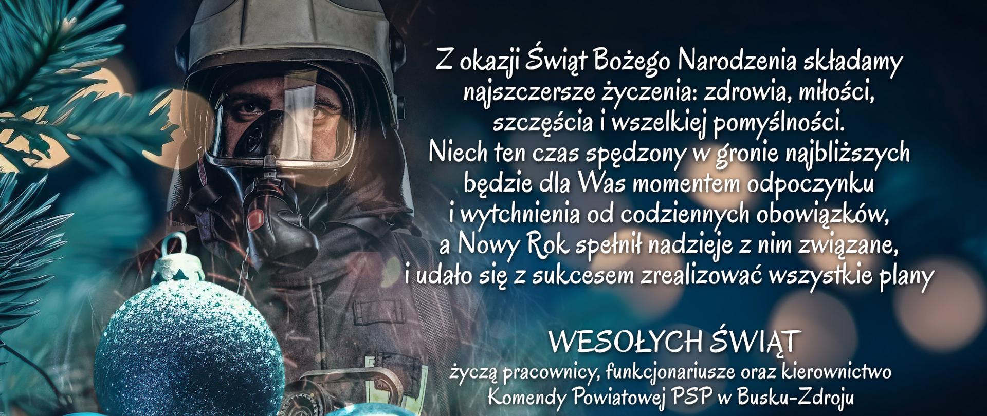Po lewej stronie na dole bobki, o góry strażak w aparacie. na dole po prawej logo PSP, po prawej stronie życzenia świąteczne
