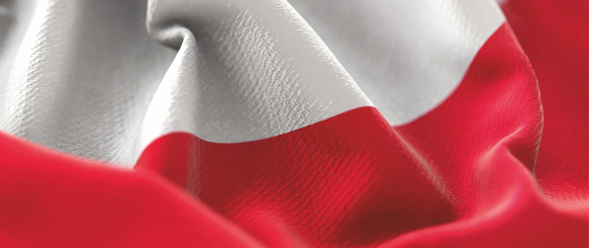 Zdjęcie przedstawia biało-czerwoną flagę reprezentującą Rzeczpospolitą Polską.