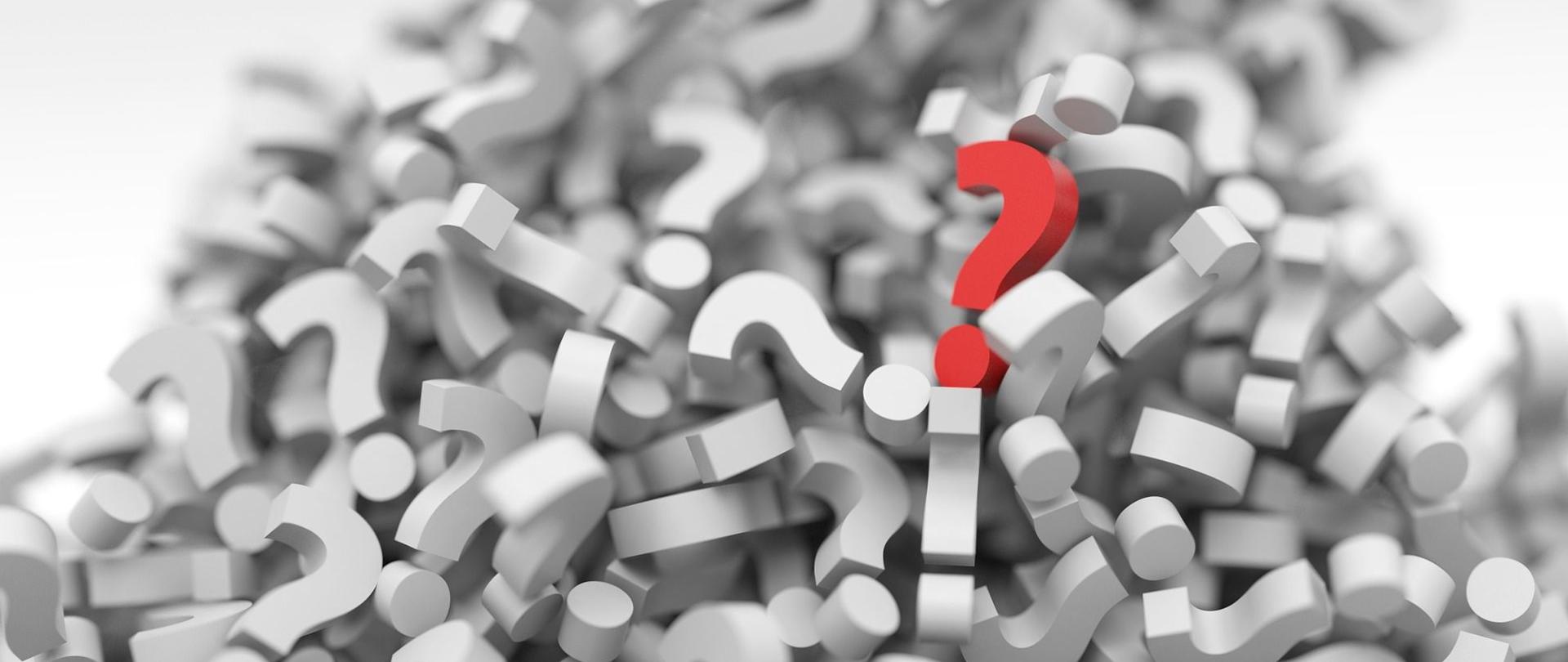 Znaki zapytania, jeden czerwony.