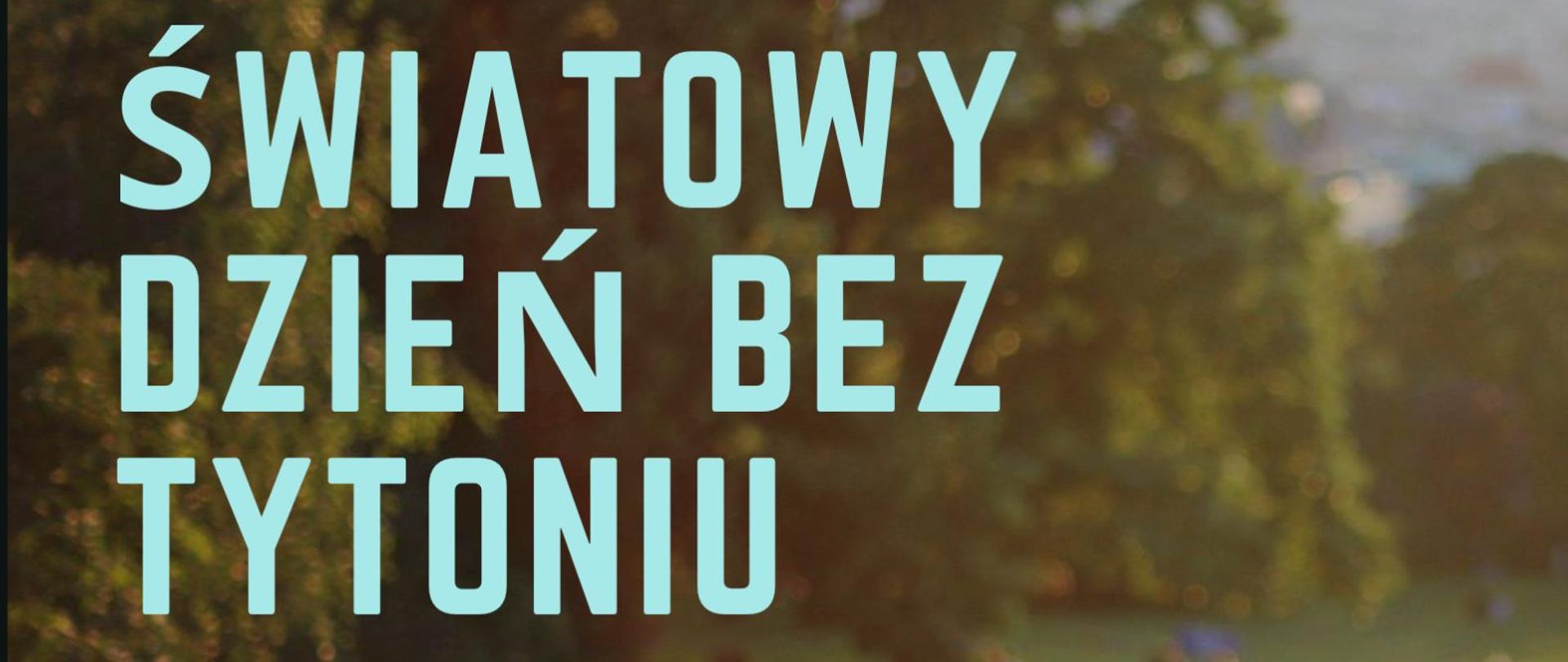 Obraz przedstawiający rozmazane korony drzew, na nich duży błękitny napis - Światowy dzień bez tytoniu. 