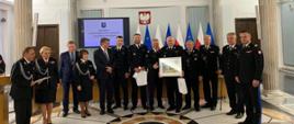 20 czerwca br. w gmachu Sejmu Rzeczpospolitej Polskiej odbyła się uroczysta konferencja pod honorowym patronatem Pana Mariusza Kamińskiego, Ministra Spraw Wewnętrznych i Administracji, z okazji jubileuszu 30-lecia Parlamentarnego Zespołu Strażaków. W konferencji udział więli: sekretarz stanu w Ministerstwie Spraw Wewnętrzych i Administracji - Pan Maciej Wąsik - oraz komendant główny Państwowej Straży Pożarnej - gen. brygadier Andrzej Bartkowiak - wraz z zastępcami i kadrą kierowniczą PSP.