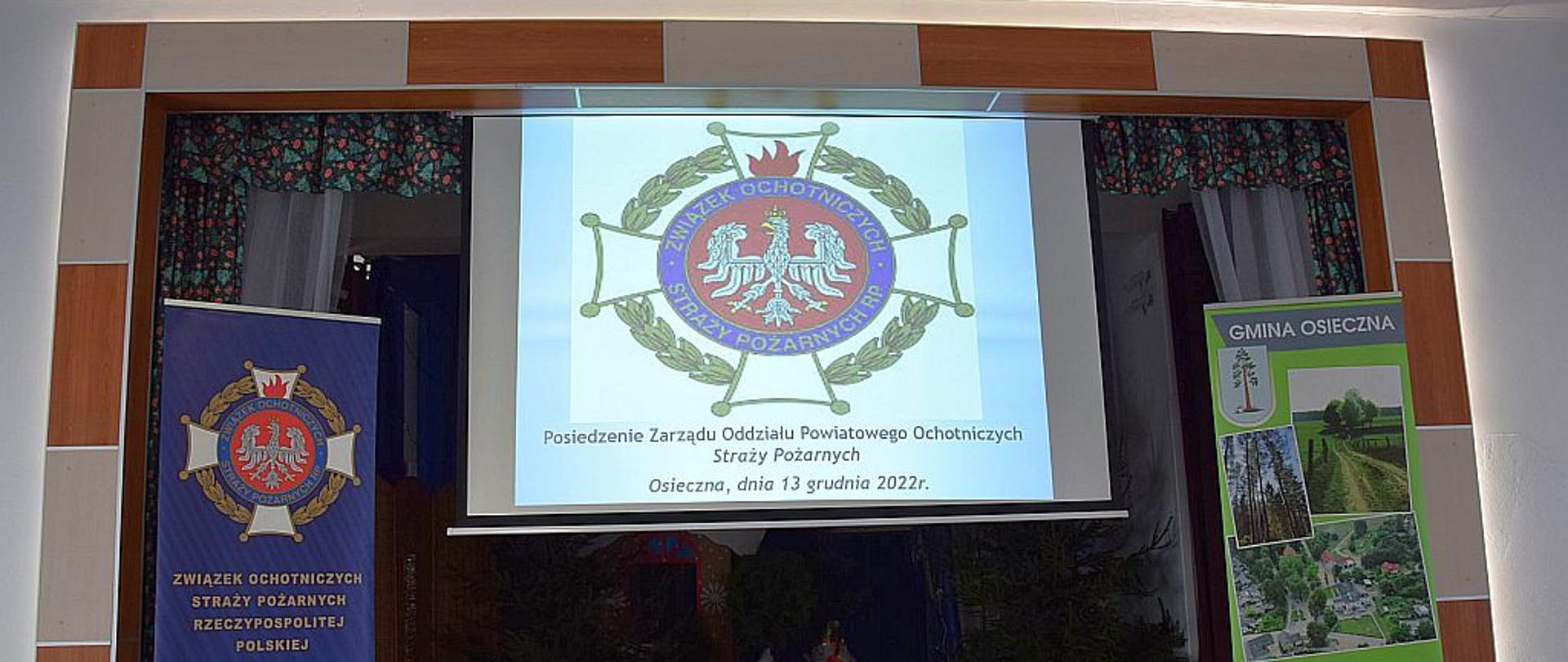 Zdjęcie przedstawia ekran prezentacji z logo ZOSP RP
