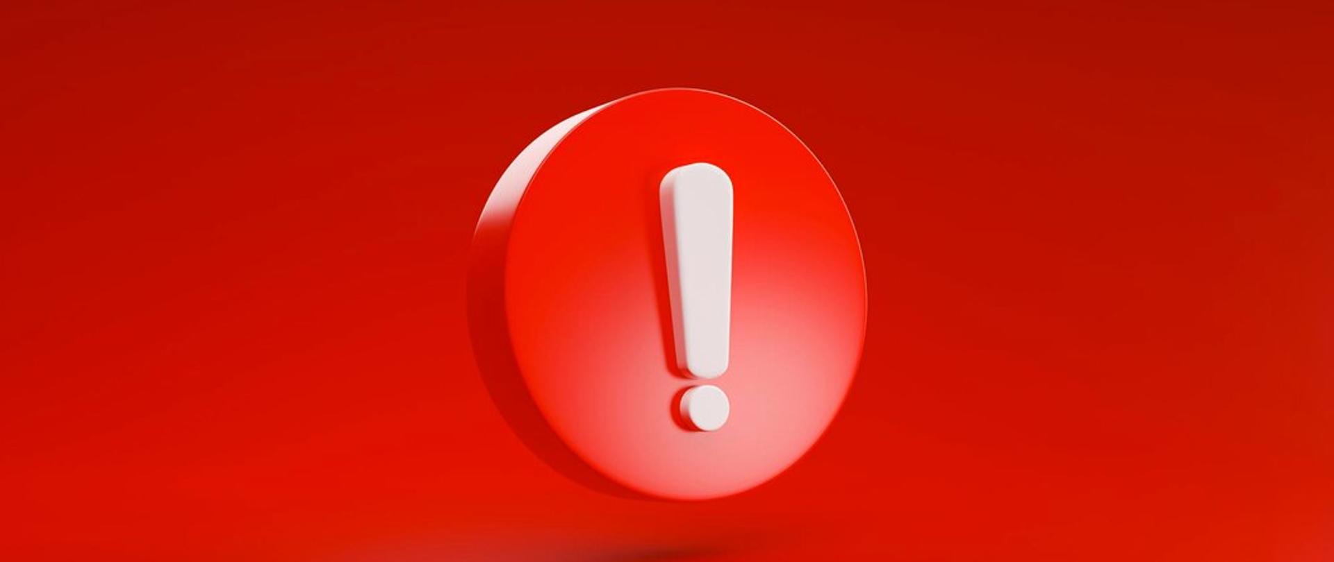 Biały wykrzyknik w czerwonym kole na czerwonym tle