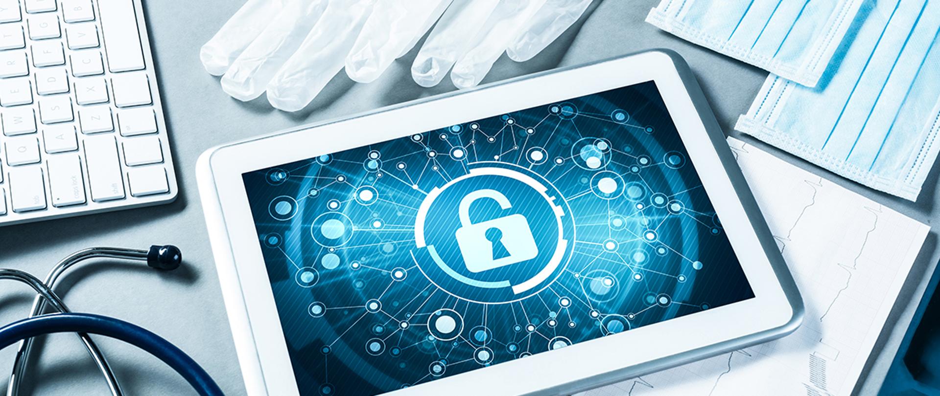 Doctors workplace with white tablet stethoscope and mask