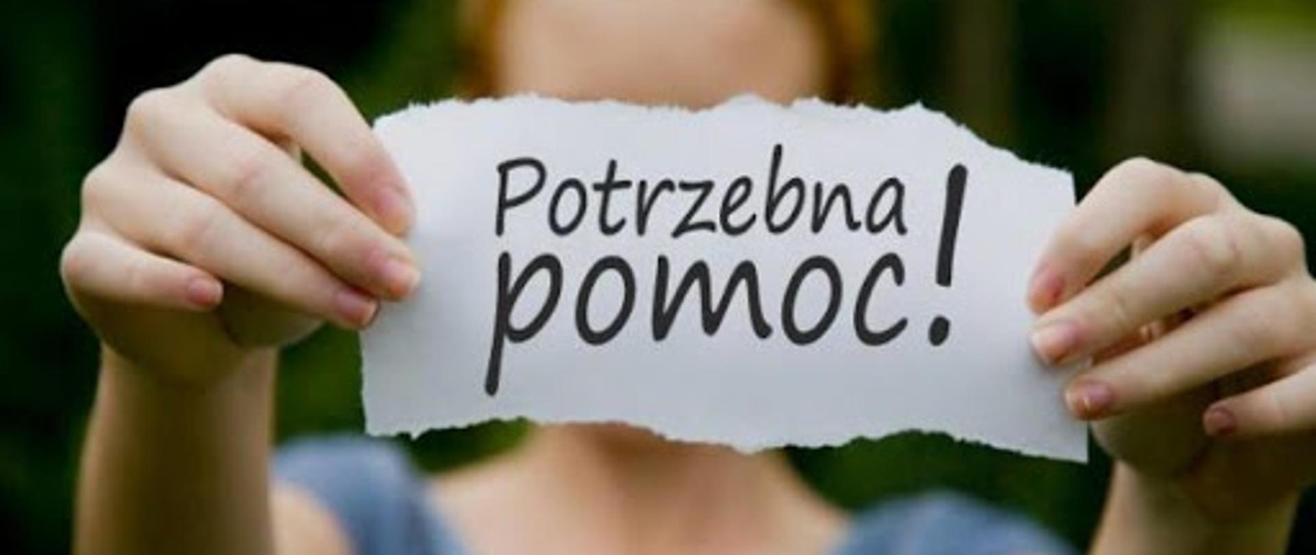 potrzebna pomoc napis trzymany w rękach