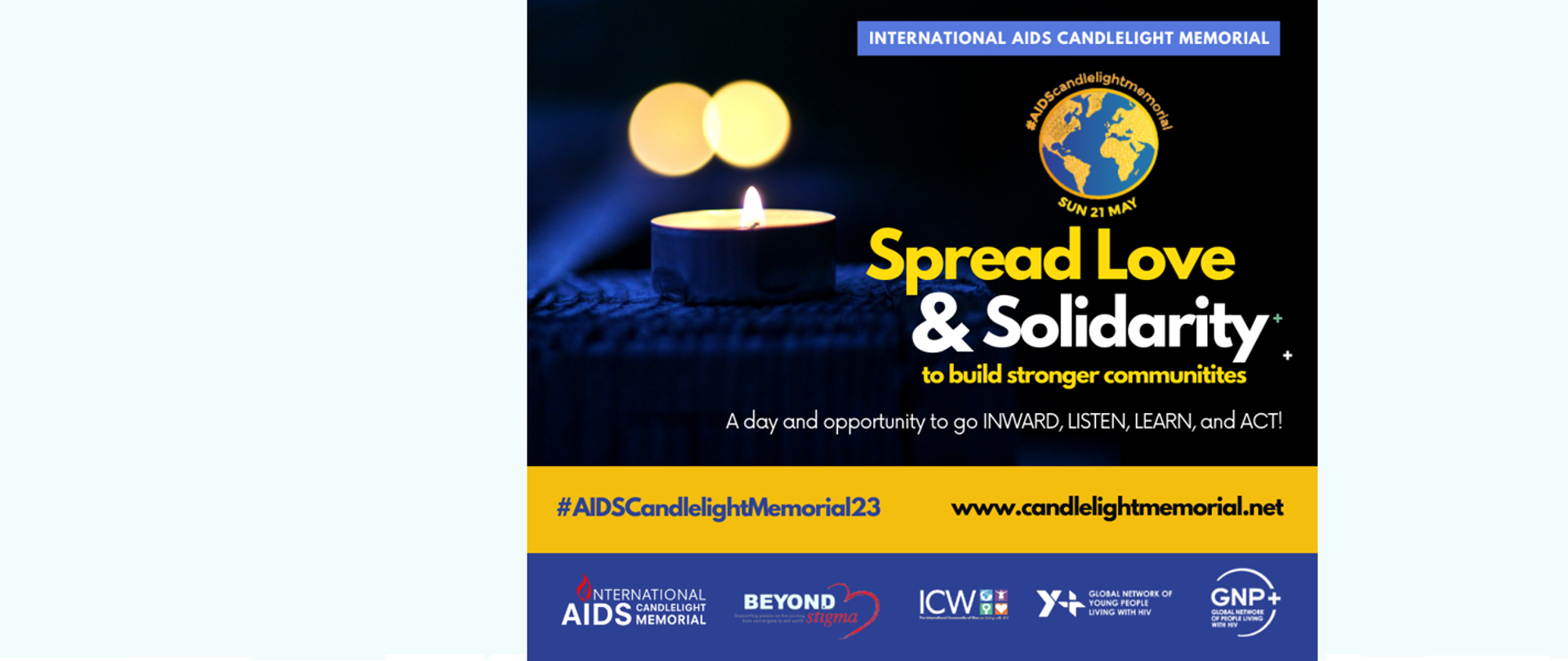 Zapalona w tle świeczka, napis po angielsku "Międzynarodowy dzień pamięci o zmarłych na AIDS"