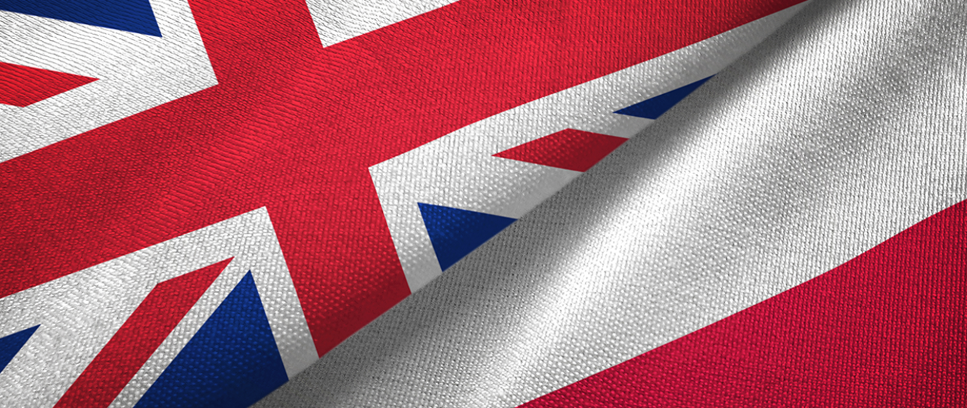 The flags of Poland and Great Britain fill the entire screen, dividing it into two halves.