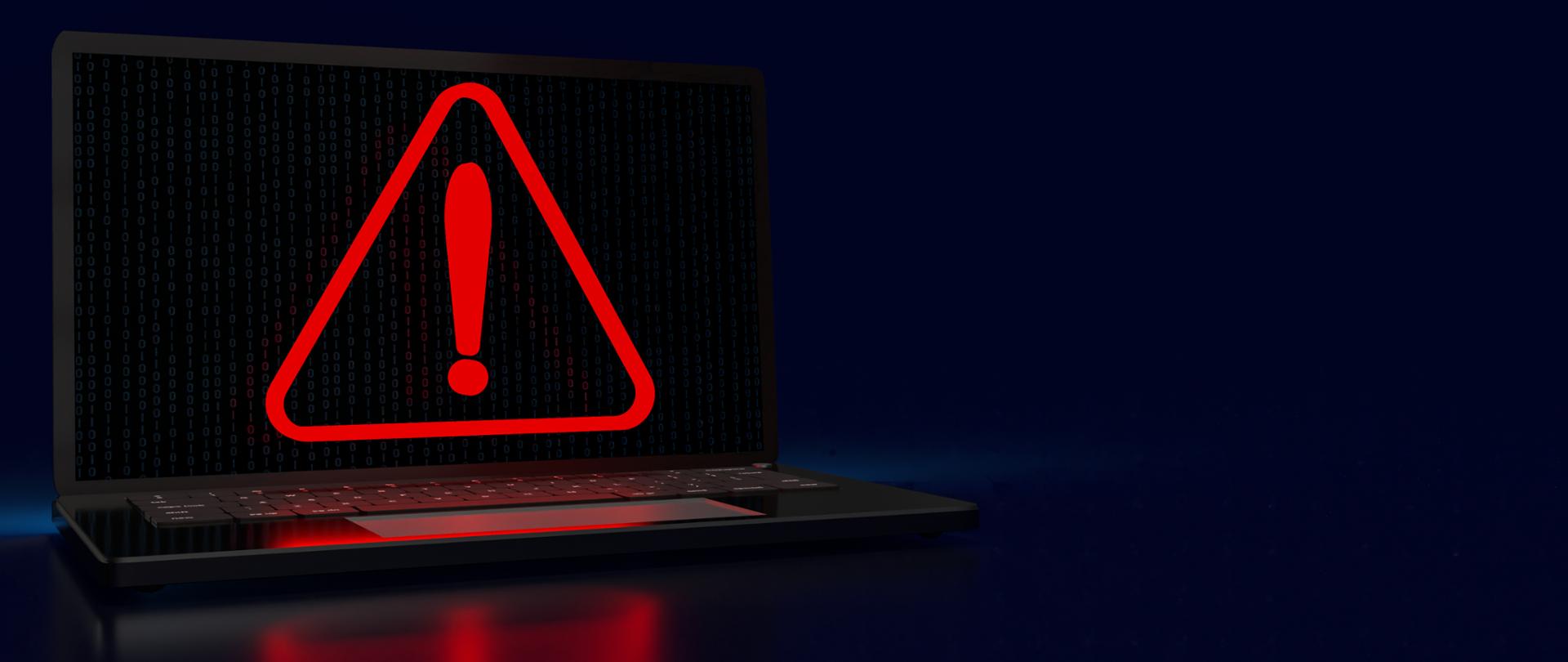 laptop a na ekranie znak ostrzegawczy