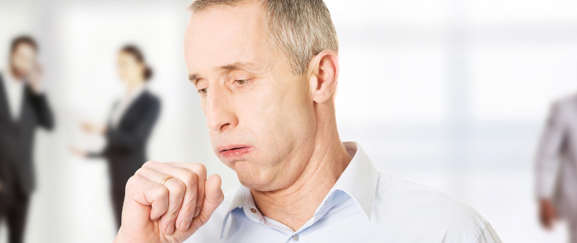 Mature man coughing because of pulmonary disease.