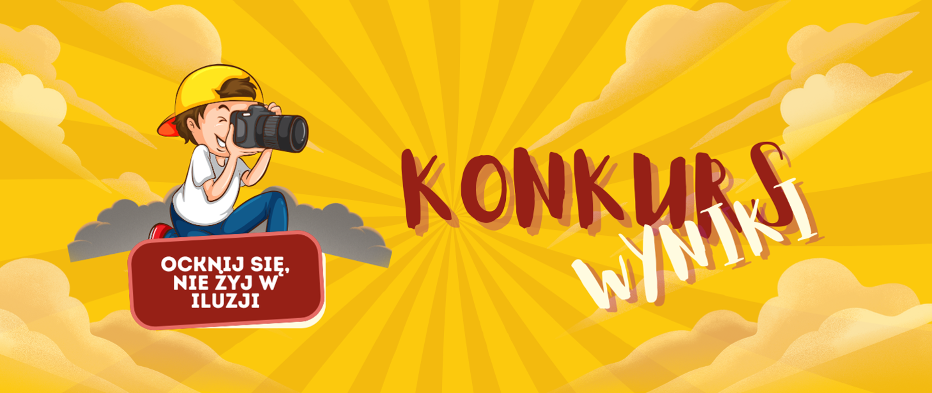 chłopiec trzymający w reku aparat fotograficzny 