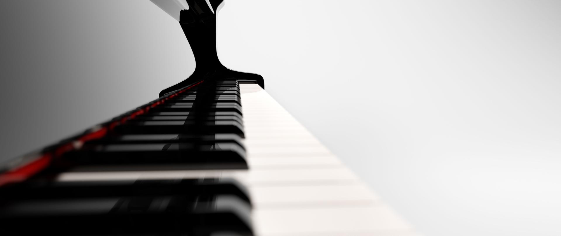 Zdjęcie przedstawia klawiaturę fortepianu.