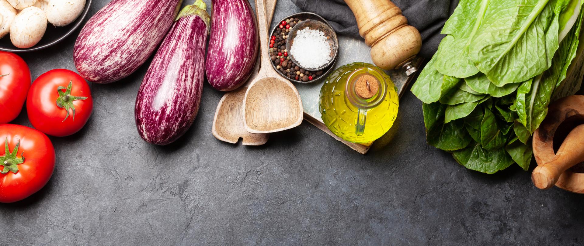 Cooking utensils and ingredients on stone background. Top view with space for your recipe or menu. Flat lay