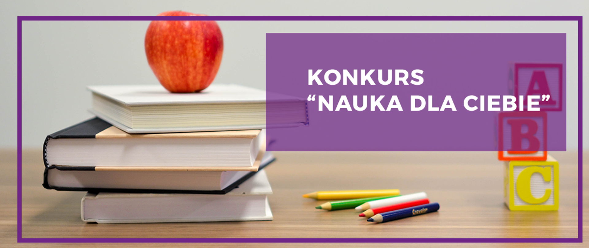 Grafika z napisem "Konkurs Nauka dla Ciebie" w której tle znajdują się książki, kredki, jabłko oraz literki A,B,C umieszczone na blacie biurka.