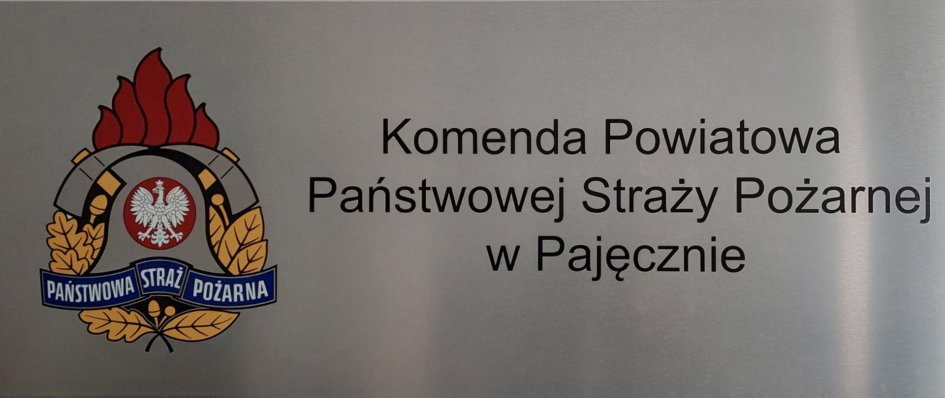 Tablica informacyjna Komendy Powiatowej Państwowej Straży Pożarnej w Pajęcznie