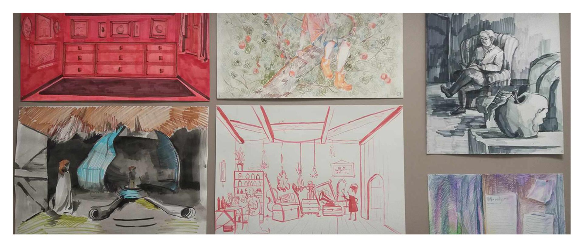 prace plastyczne powieszone na ścianie