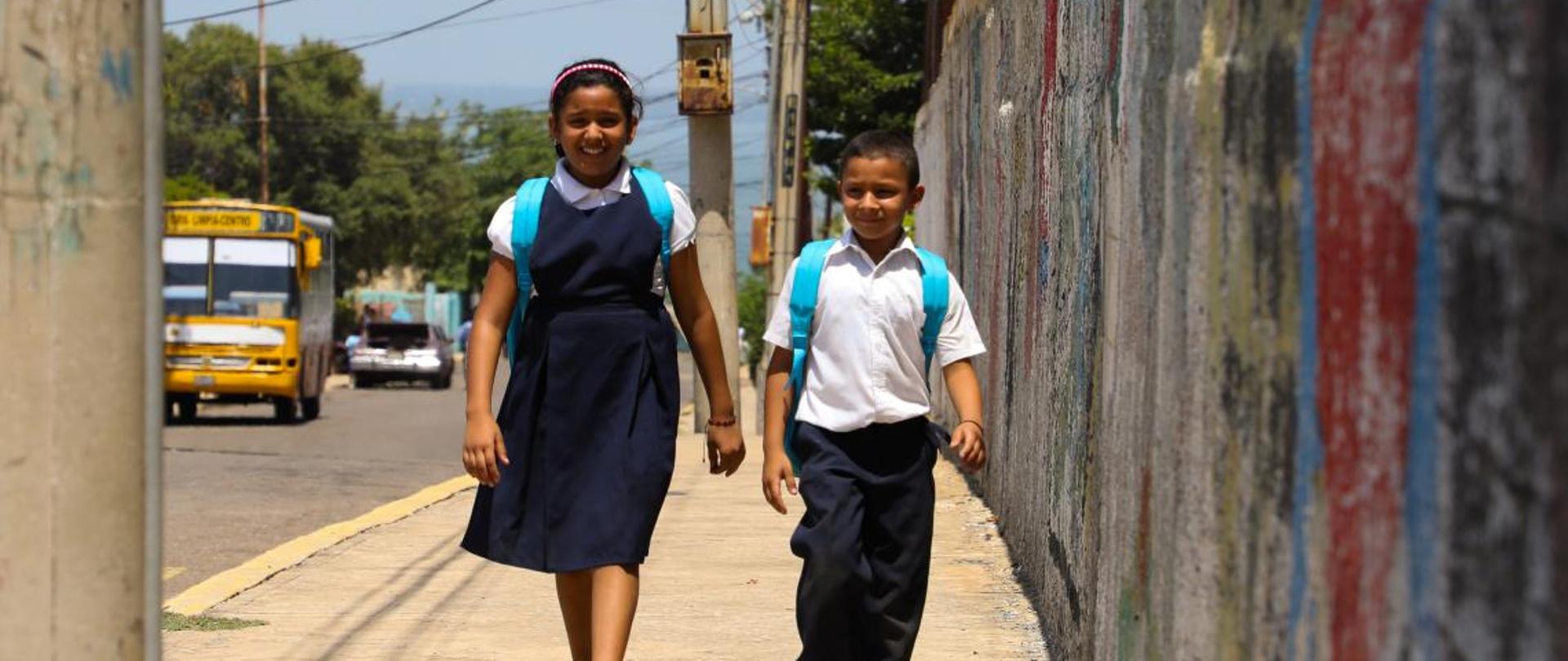 Valeria and Manuel on their way to school, 
