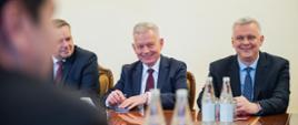 In the photo, from left to right, seated at a table with bottles of water on it are: Colonel Rafał Syrysko, Head of the Internal Security Agency; Paweł Radomski, Polish Ambassador to Azerbaijan; and Tomasz Siemoniak, Minister-Coordinator of Special Services. 