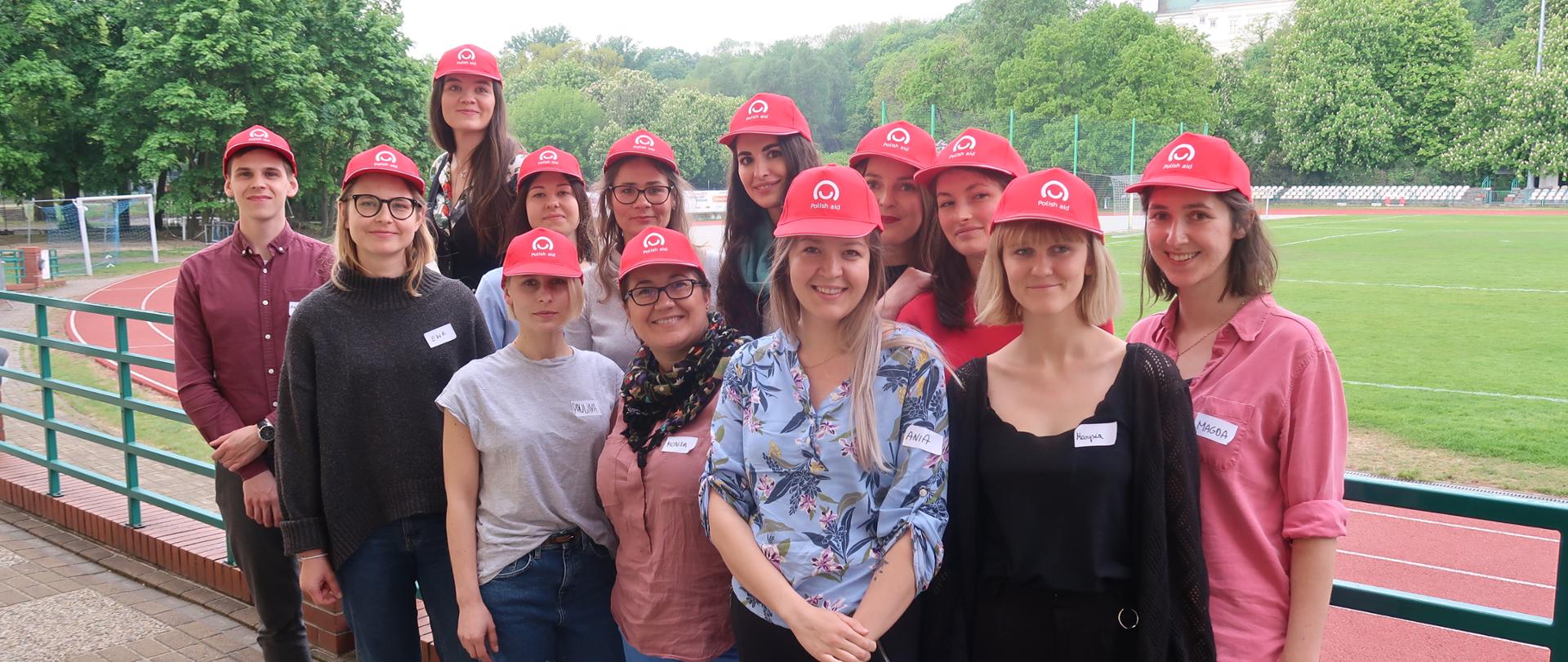 A group of volunteers with Polish Aid red hats