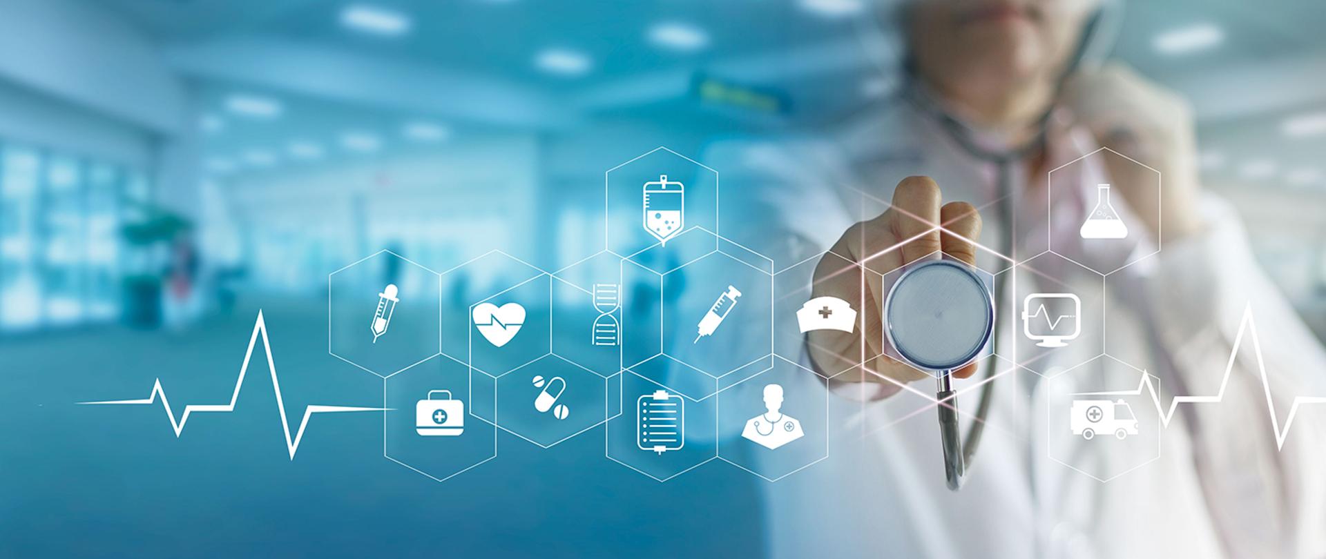 Zdjęcie ilustracyjne - lekarz przykładający stetoskop do ekranu, obok stetoskopu ikony kojarzące się z medycyną - elektrokardiogram, strzykawka, kroplówka i in.