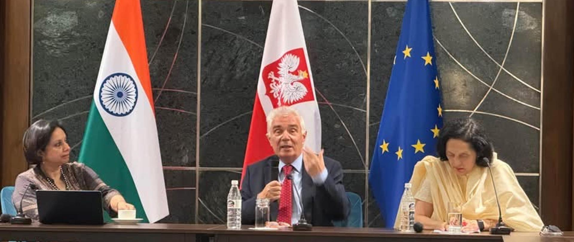 Participants in the sixth edition of the Shantipath Debates take part in a panel discussion. Suhasini Haidar, Dr Piotr Antoni Świtalski and Ambassador Ruchira Kamboj are seated at the table; Dr Świtalski is speaking and gesturing, with the flags of India, Poland and the European Union visible behind them.