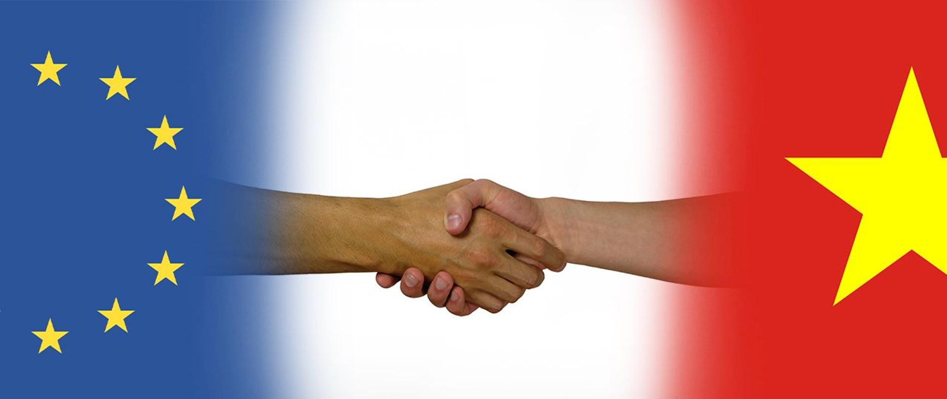 Flaga UE i flaga Wietnamu, na środku podanie dłoni