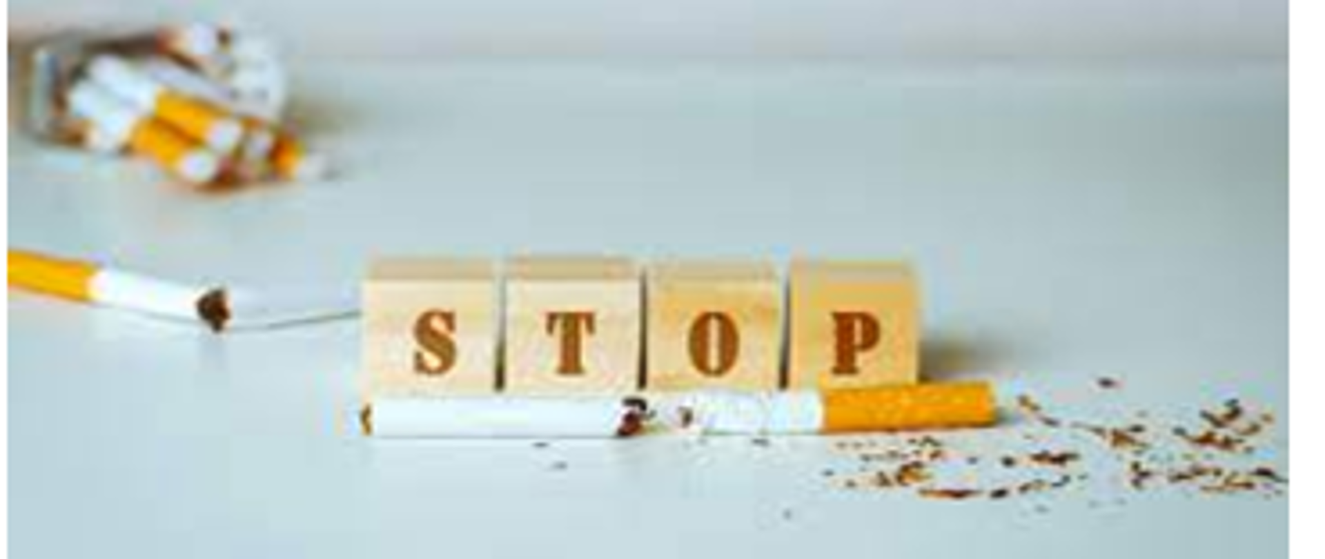 Grafika z zdjęciem złamanego papierosa z napisem STOP z klocków drewnianych
