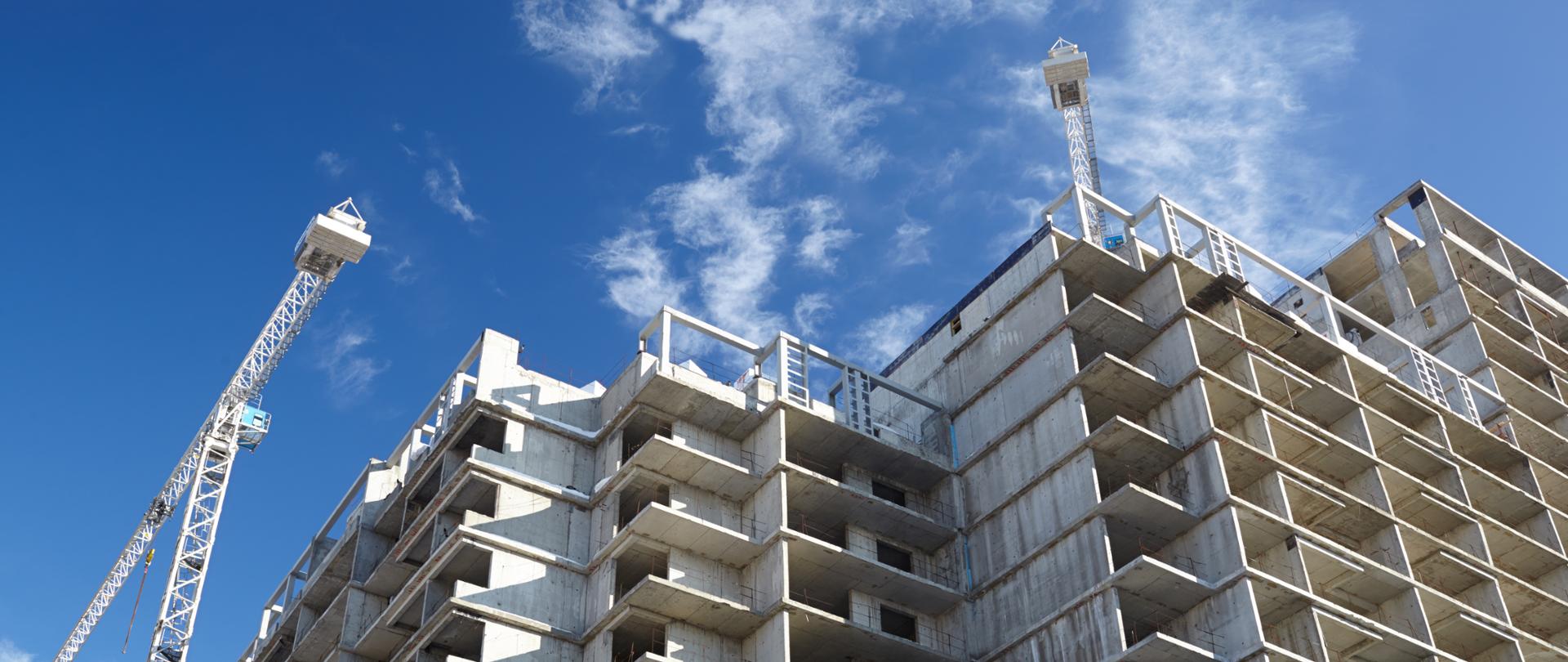 Construction of building. Beautiful sky background.