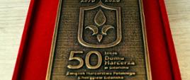 Zdjęcie przedstawia medal z okazji 50. rocznicy otwarcia Domu Harcerza w Gdańsku.