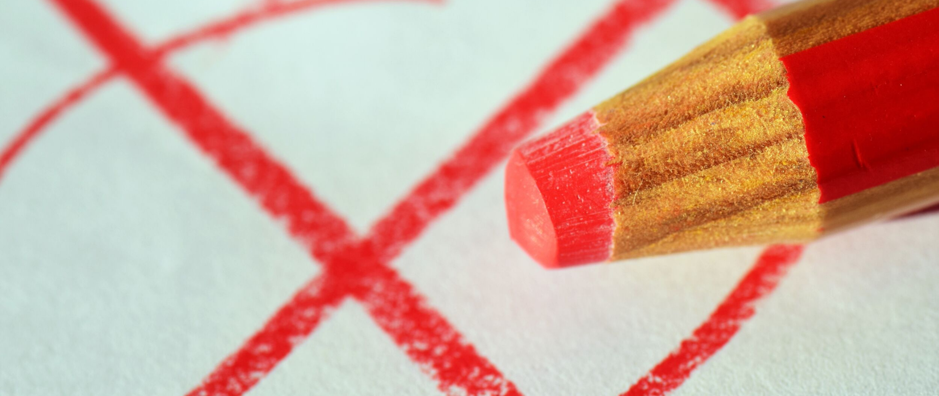 Ołówek oraz krzyżyk w kółku