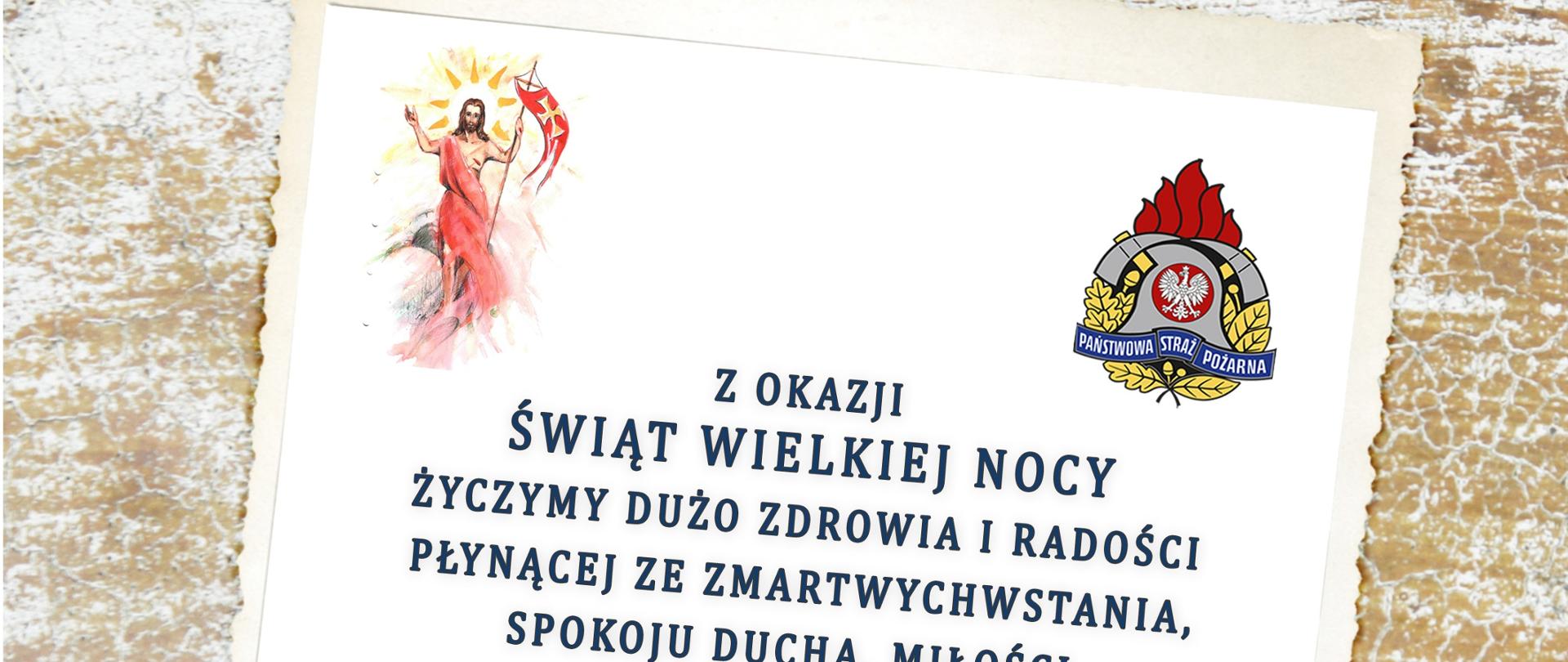 Kartka Wielkanocna na dole w trawie leżą pisanki na górze kartka w wielkanocnymi życzeniami