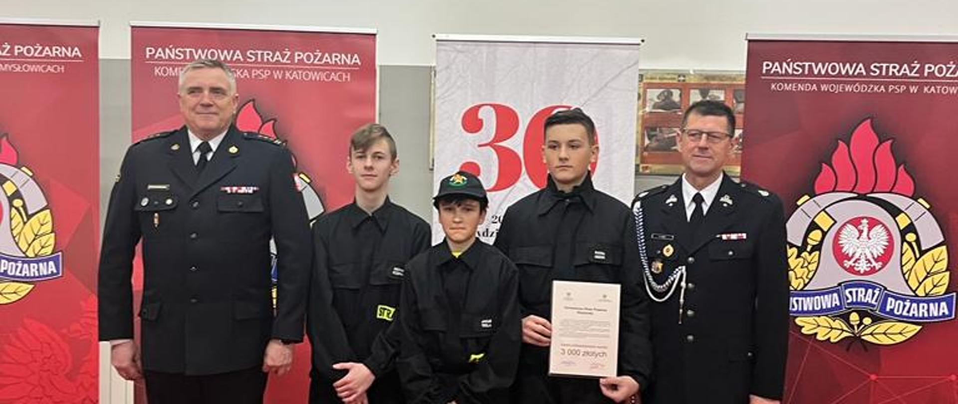 Uroczystość wręczenia promes dotacji celowej dla Ochotniczych Straży Pożarnych na zakup sprzętu dla członków Młodzieżowych Drużyn Pożarniczych z Tychów, Katowic, Mysłowic, Rudy Śląskiej oraz Siemianowic Śląskich