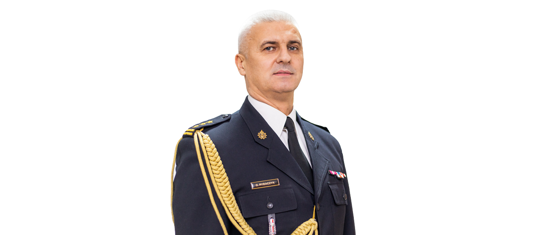 Zdjęcie przedstawia Komendanta Powiatowego PSP w Szczytnie st.bryg. Grzegorza Rybaczyka w mundurze służbowym