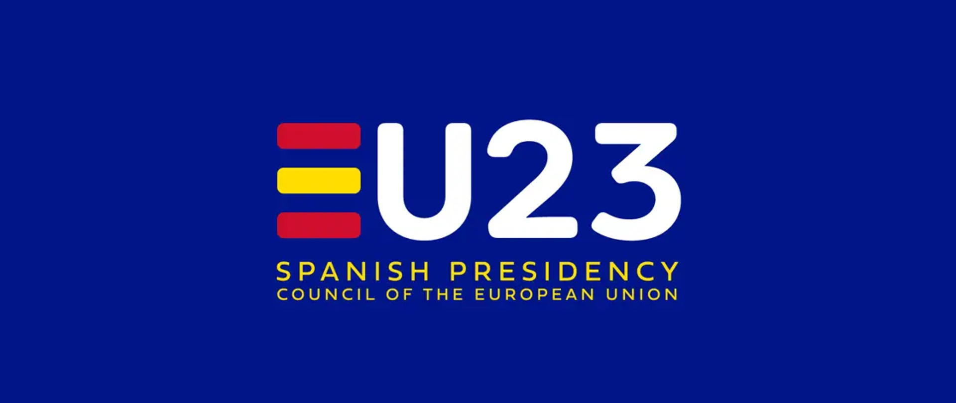 Na granatowym tle napis "EU23 spanish presidency council of the Euopean Union", gdzie pierwsze E jest dwukolorowe: czerwono-żółte