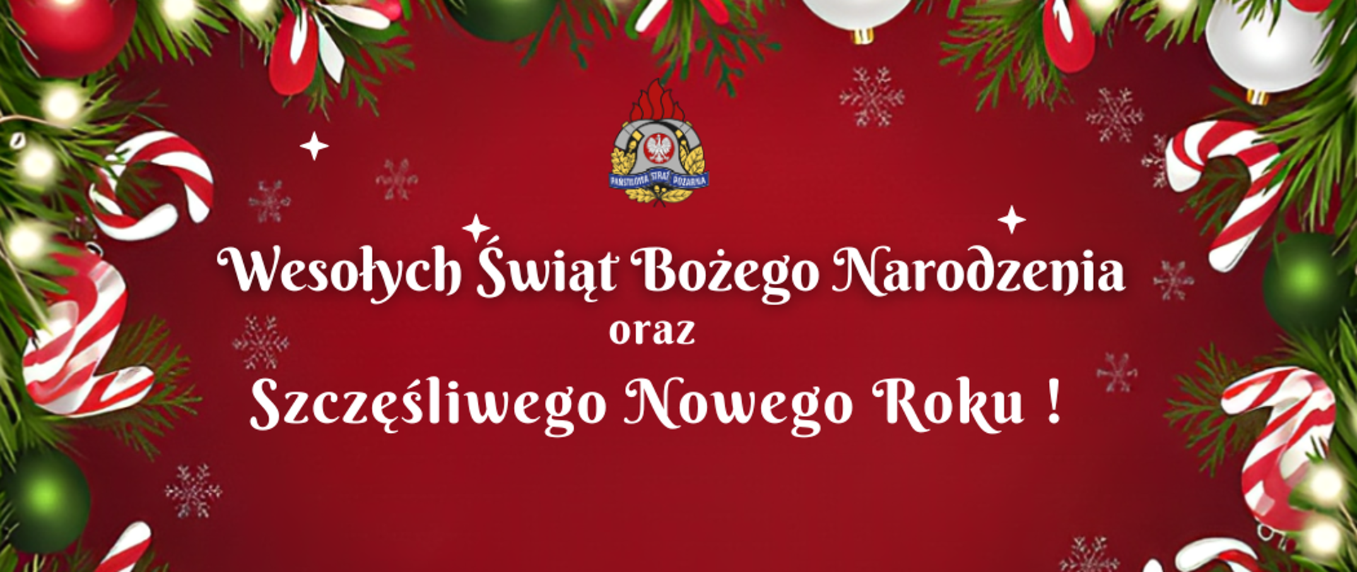 Na czerwonym tle białymi literami widnieje napis: Wesołych Świąt Bożego Narodzenia oraz Szczęśliwego Nowego Roku ! dookoła są białe, zielone i czerwone bombki, zielone gałązki i białe światełka. Poniżej napisu widać małą białą choinkę.
